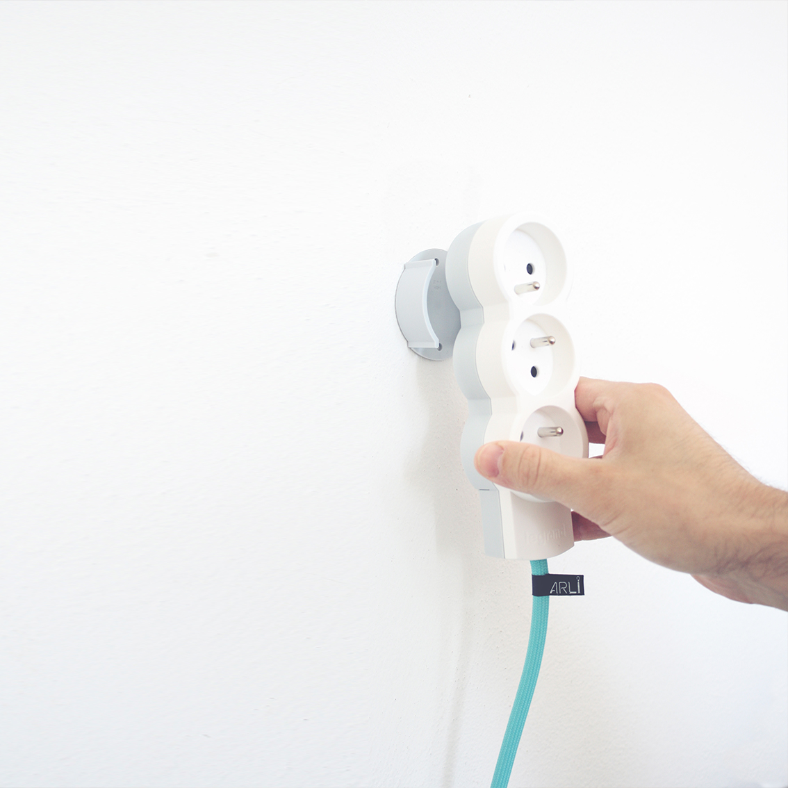 Extension cord with wall mount and colorful textile cable